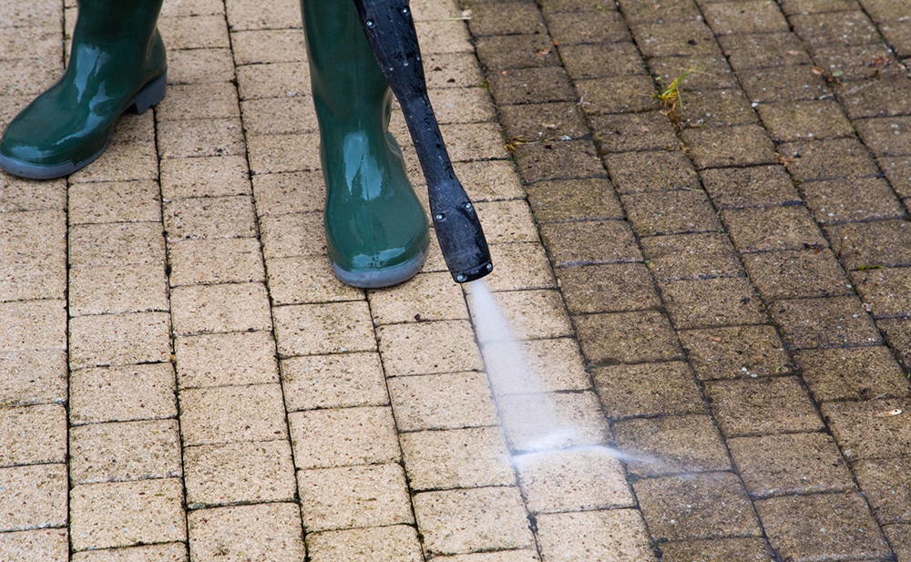 Pressure washing a driveway